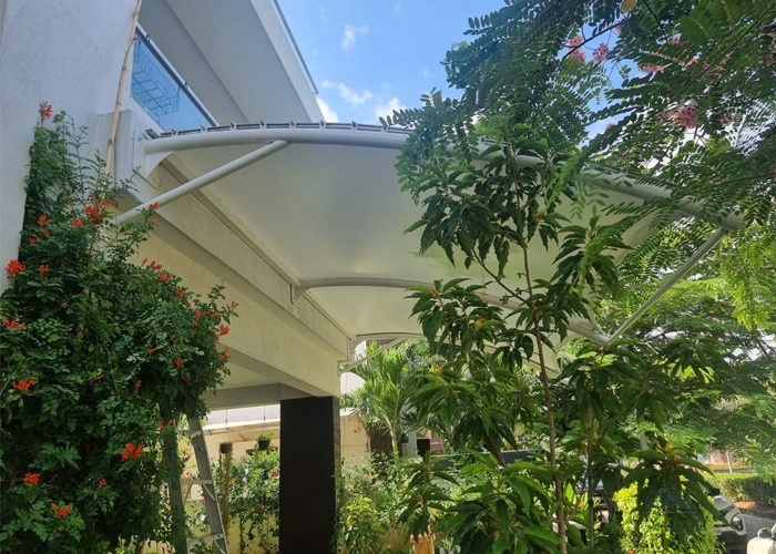 Tensile membrane roofing structure